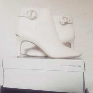 Calvin Klein white booties.